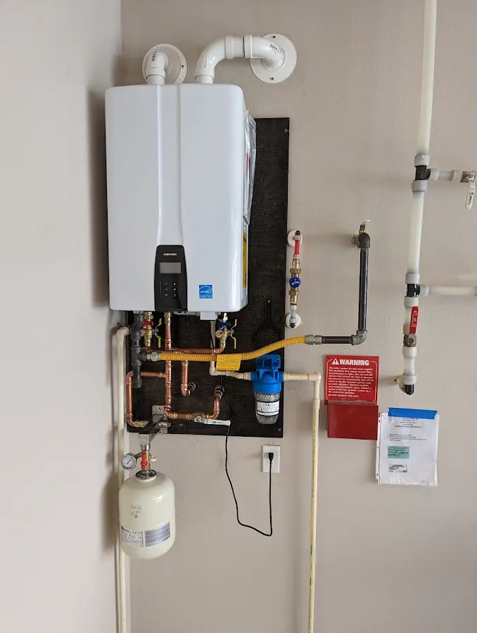 Professional plumber installing copper piping in a Union Hill-Novelty Hill home